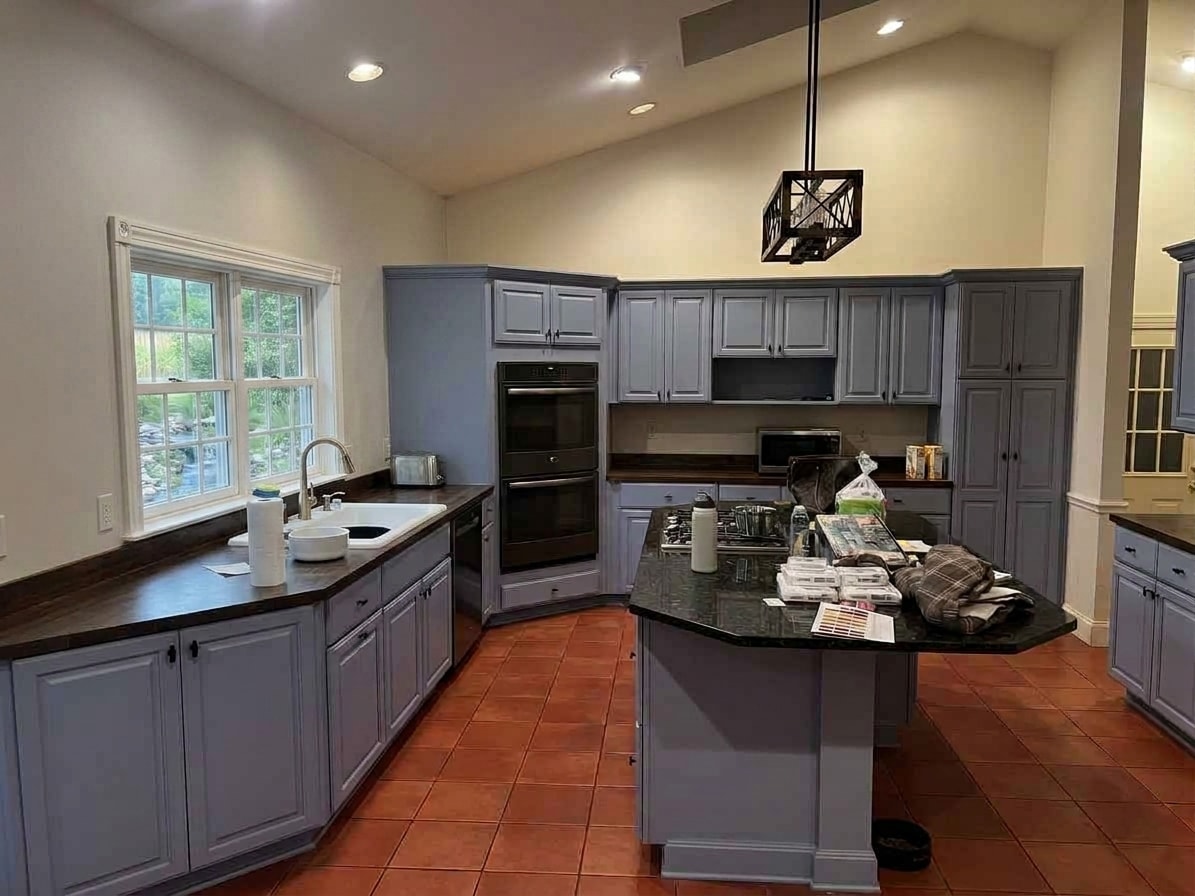 Outdated kitchen before remodeling — dark cabinets and worn countertops Rochester NY